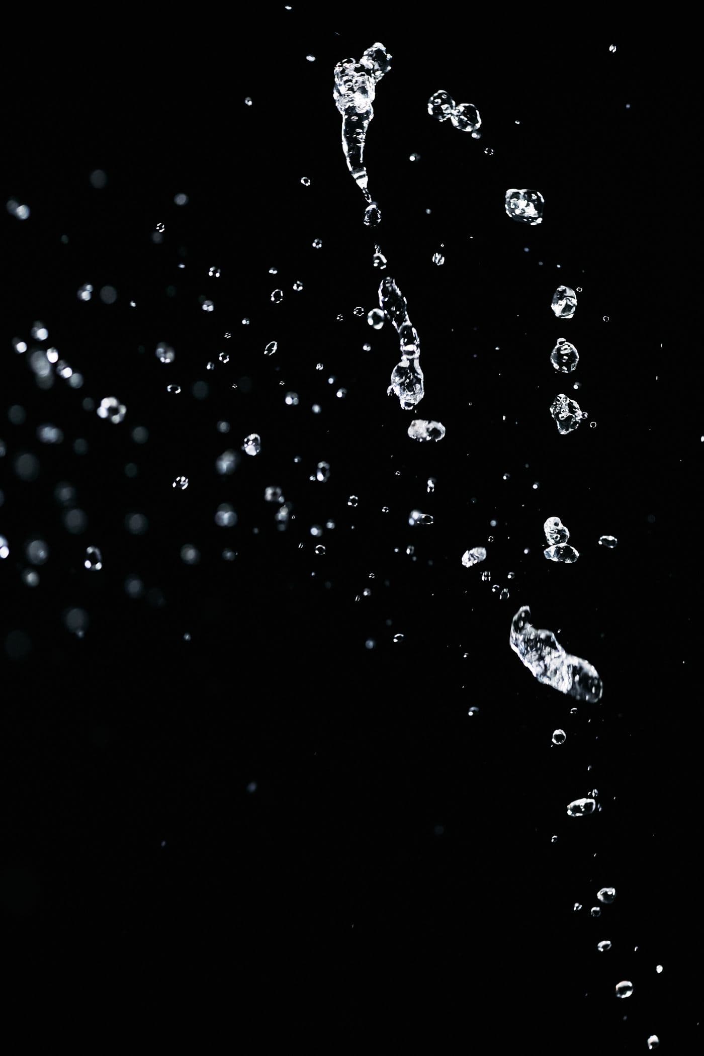A crystalline structure lit from one side against a dark background